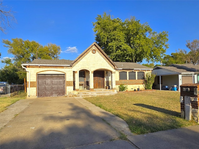 single story home with a porch, a front yard, and a garage