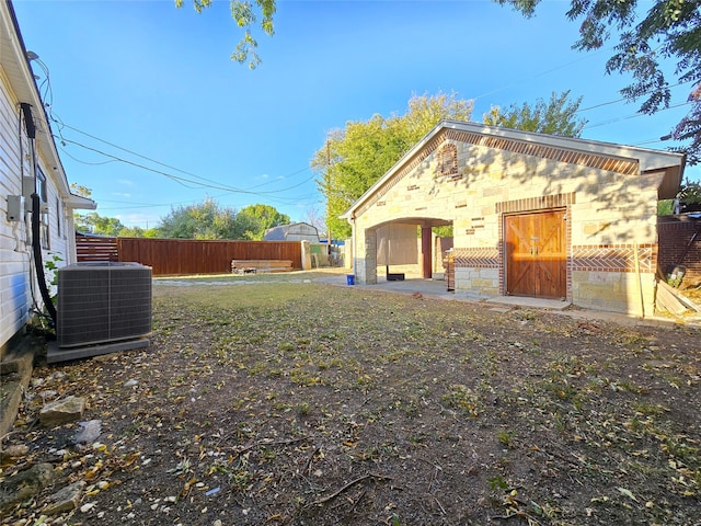 view of yard with central AC unit