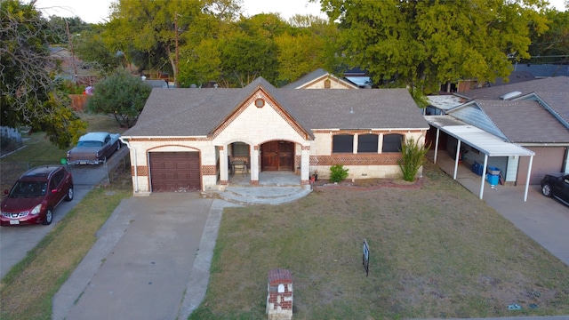 view of front of house with a front lawn, a garage, a porch, and a carport