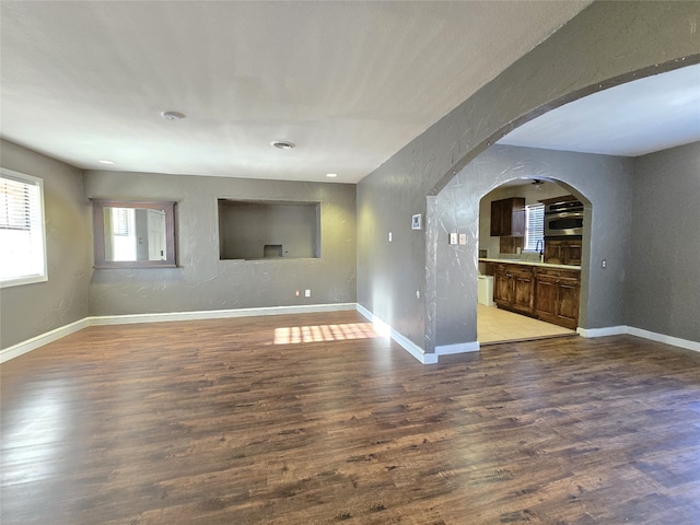 unfurnished living room with hardwood / wood-style flooring