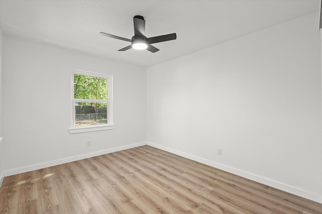 spare room with light hardwood / wood-style floors and ceiling fan