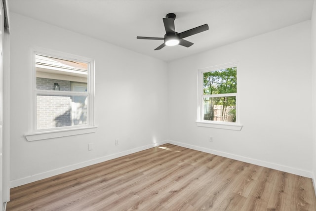 empty room featuring ceiling fan and light wood-type flooring