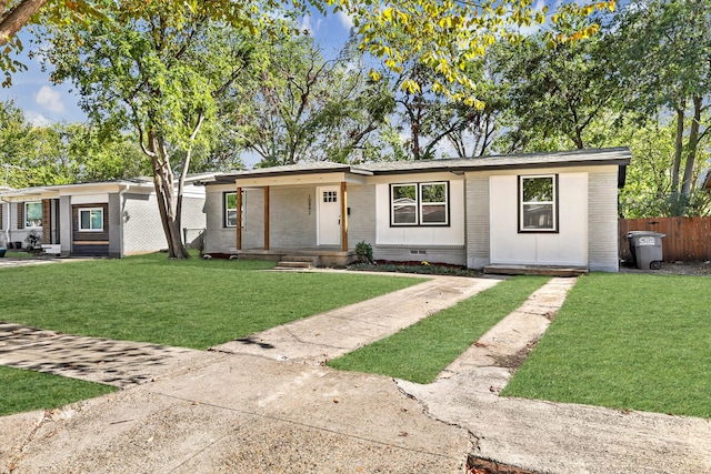 ranch-style house with a front yard