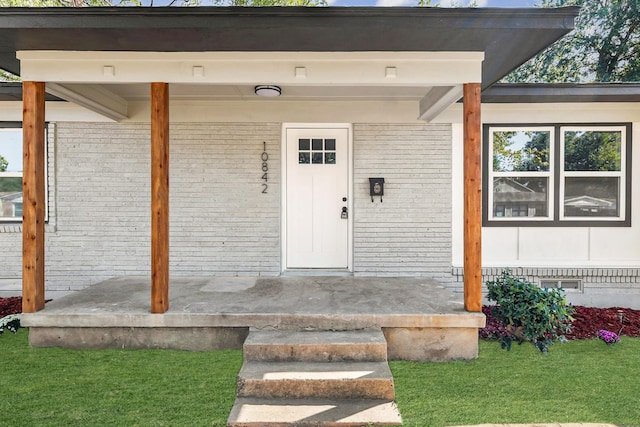 entrance to property featuring a porch