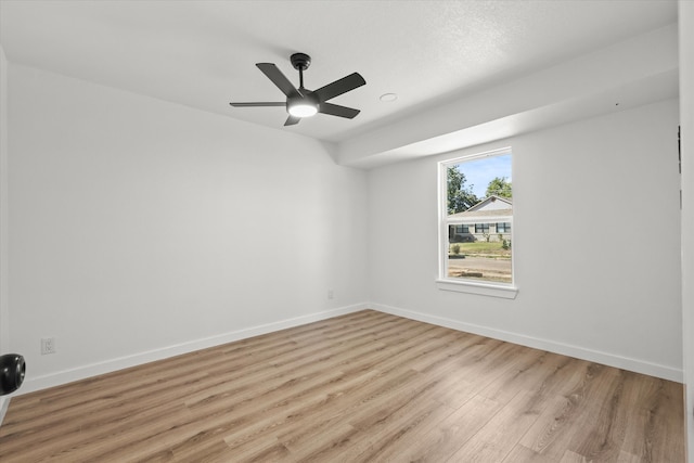 empty room featuring light hardwood / wood-style flooring and ceiling fan