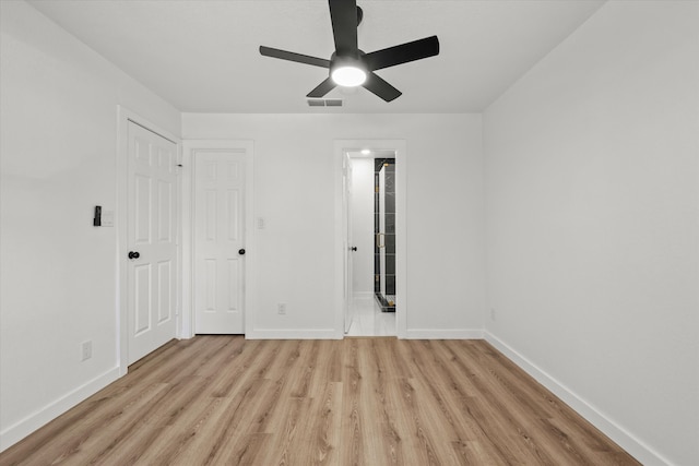 unfurnished room featuring ceiling fan and light wood-type flooring