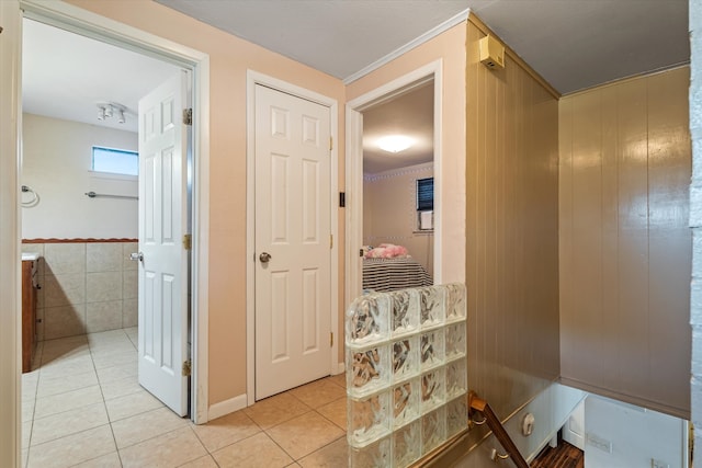 corridor featuring light tile patterned flooring