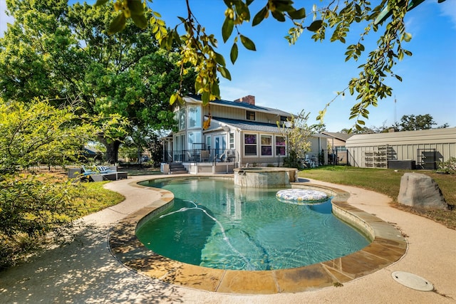 view of pool featuring an in ground hot tub