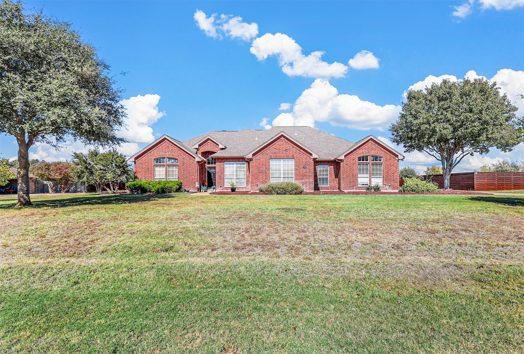 ranch-style house with a front lawn