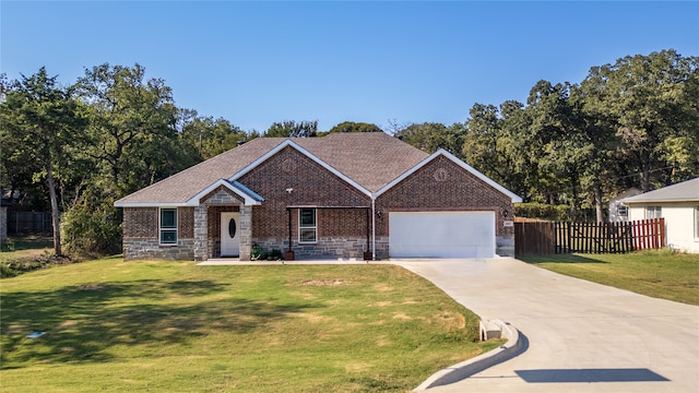 view of front facade with a front lawn and a garage