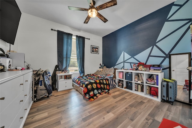 bedroom featuring hardwood / wood-style floors and ceiling fan