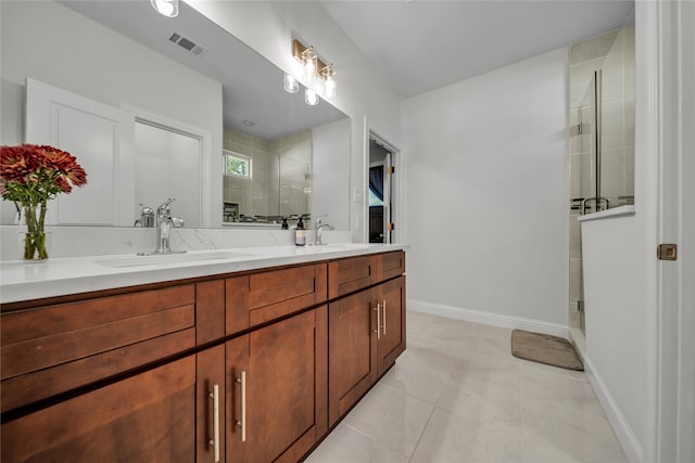 bathroom with vanity, tile patterned flooring, and an enclosed shower