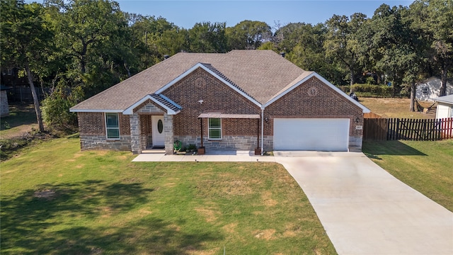 view of front of property with a front lawn and a garage