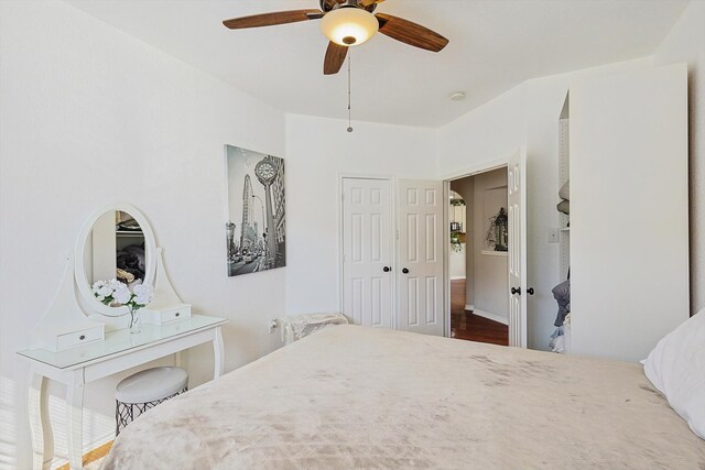 bedroom featuring dark hardwood / wood-style flooring and ceiling fan