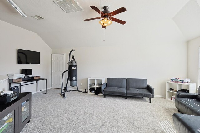 workout area with light carpet, ceiling fan, and vaulted ceiling