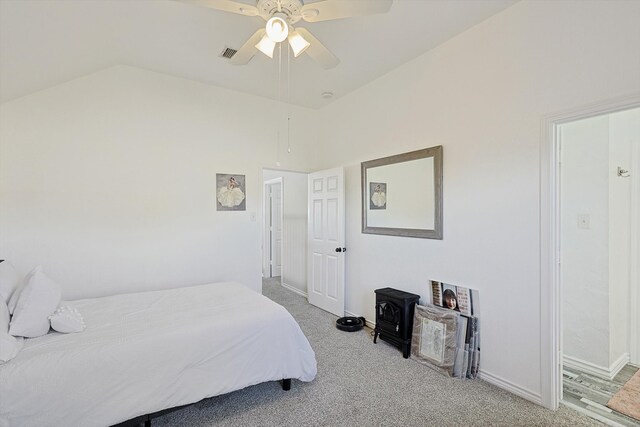 bedroom featuring carpet floors, vaulted ceiling, and ceiling fan