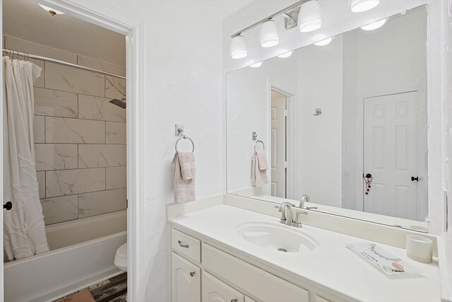 full bathroom featuring toilet, hardwood / wood-style flooring, shower / bath combination with curtain, and vanity