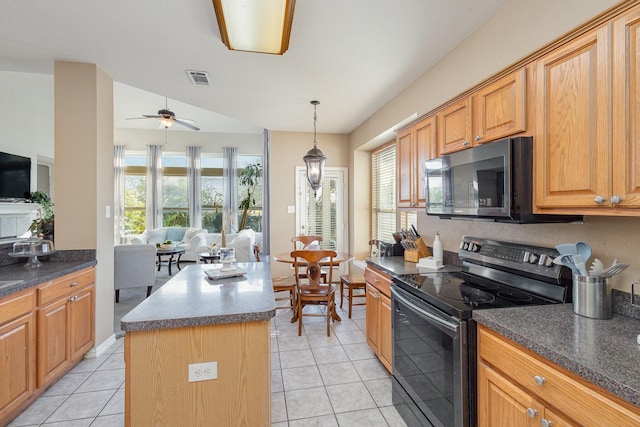 kitchen with light tile patterned floors, black range with electric cooktop, a kitchen island, pendant lighting, and ceiling fan