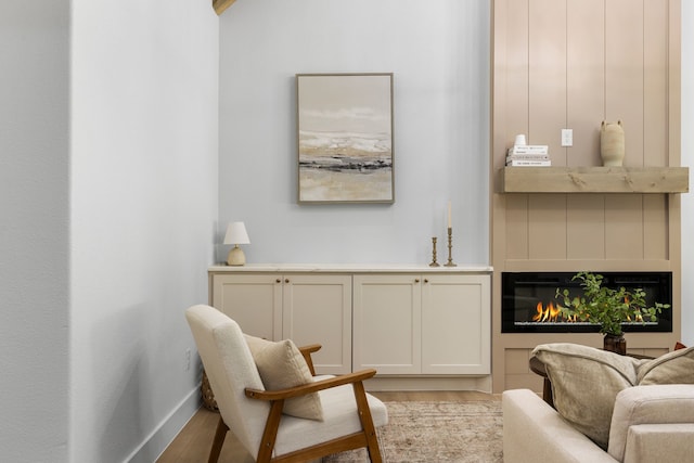 sitting room featuring light hardwood / wood-style floors