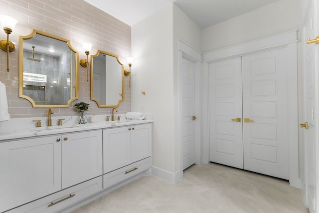 bathroom with vanity, tile patterned floors, backsplash, and walk in shower