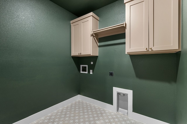 laundry room with cabinets, hookup for an electric dryer, and hookup for a washing machine