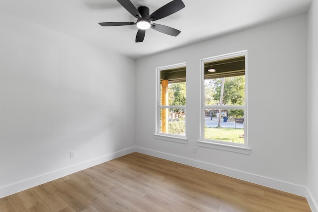 spare room with light hardwood / wood-style floors and ceiling fan