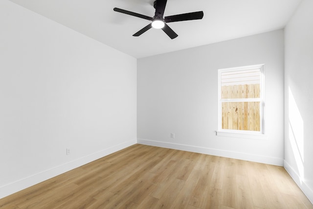 empty room with light wood-type flooring and ceiling fan