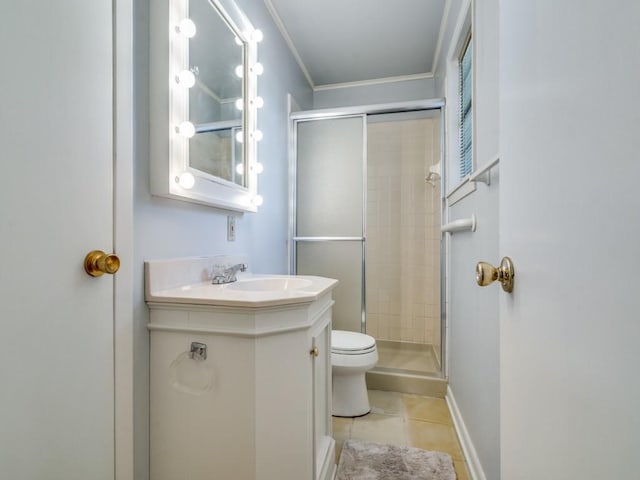 bathroom with tile patterned floors, vanity, crown molding, toilet, and a shower with shower door