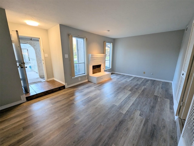 unfurnished living room featuring hardwood / wood-style floors