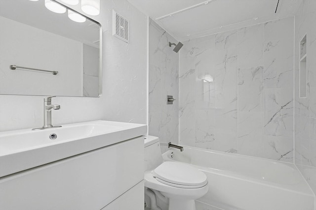 full bathroom featuring vanity, toilet, and tiled shower / bath combo