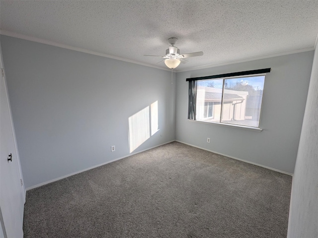 empty room featuring dark colored carpet, a textured ceiling, ceiling fan, and crown molding