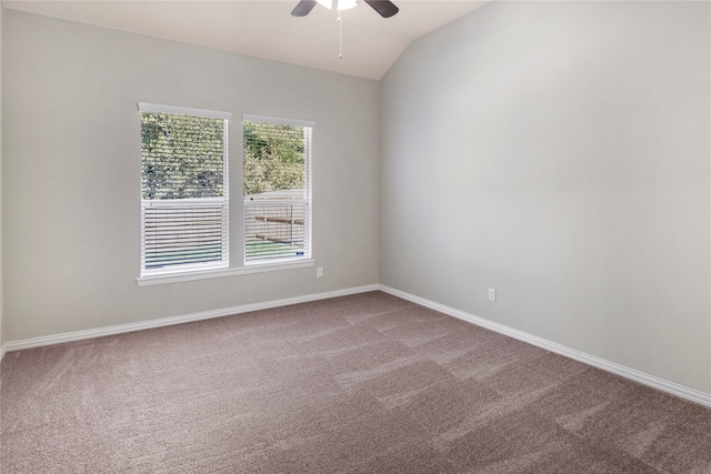 carpeted spare room with lofted ceiling and ceiling fan