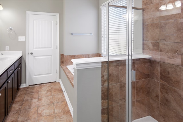 bathroom with vanity, tile patterned flooring, and plus walk in shower