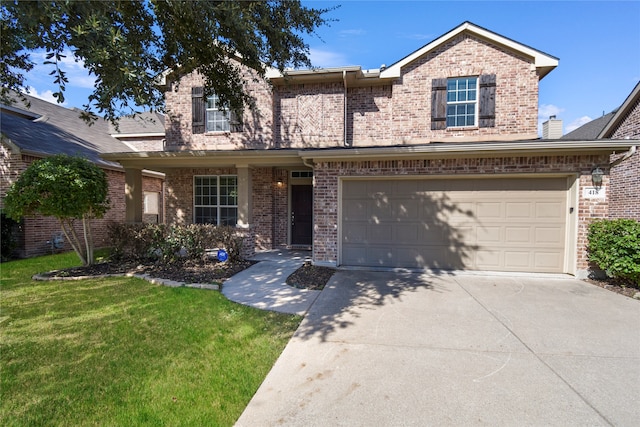 view of front of house with a front yard and a garage