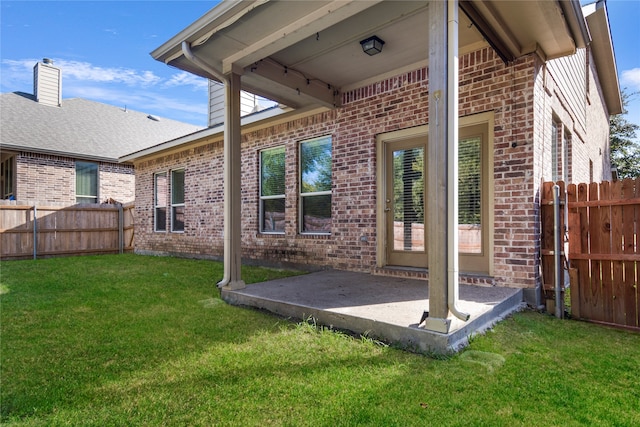 back of house featuring a yard