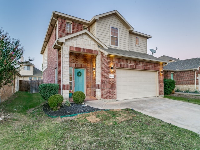 view of front of house with a front yard and a garage