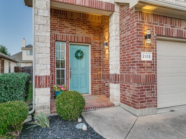 property entrance with a garage