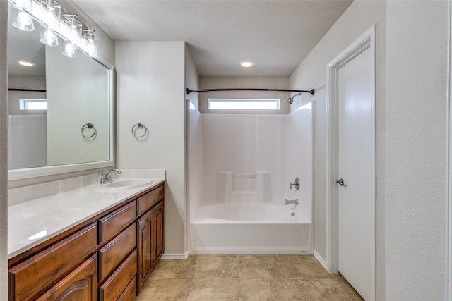 bathroom with vanity, a textured ceiling, shower / tub combination, and tile patterned flooring