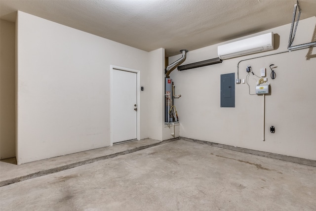 garage featuring a wall unit AC, water heater, and electric panel