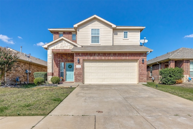 view of front of property featuring a garage and a front lawn