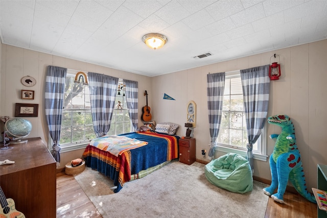 bedroom with wood-type flooring