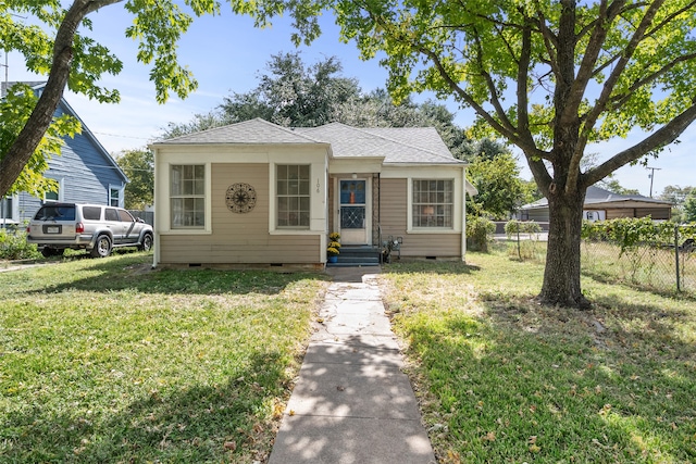 bungalow-style house with a front yard