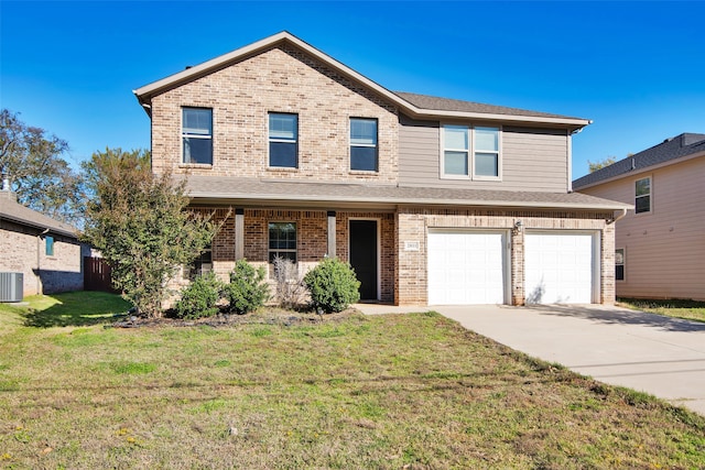 view of front of home with central AC, a front lawn, and a garage