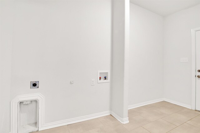 washroom featuring washer hookup, light tile patterned floors, and electric dryer hookup