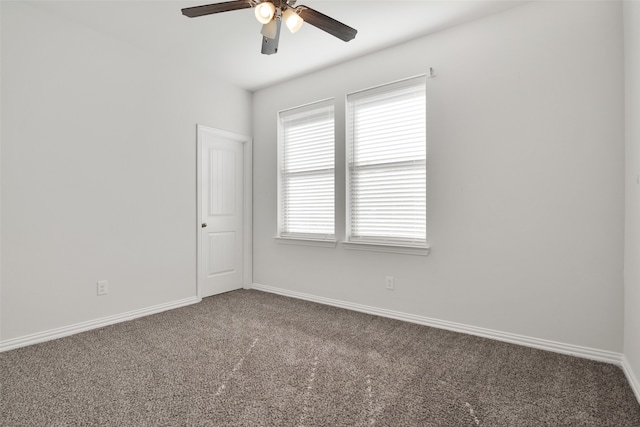 carpeted empty room with ceiling fan