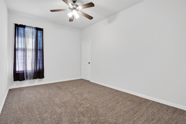 unfurnished room featuring ceiling fan and carpet floors