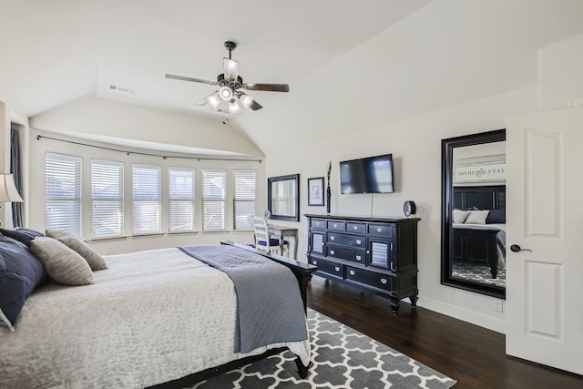 bedroom featuring ceiling fan, dark wood-type flooring, and vaulted ceiling