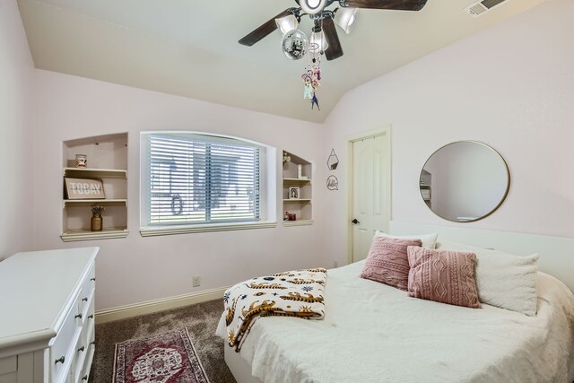 carpeted bedroom with vaulted ceiling and ceiling fan