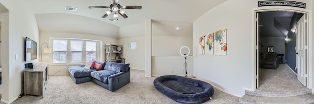 living area featuring light carpet, lofted ceiling, and ceiling fan