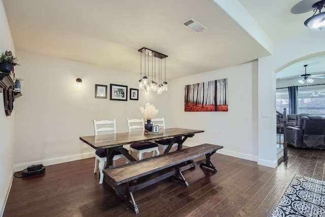 dining room featuring ceiling fan and dark hardwood / wood-style flooring